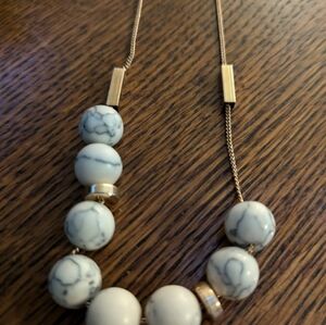 Vintage strand of howlite beads with gold tone accents